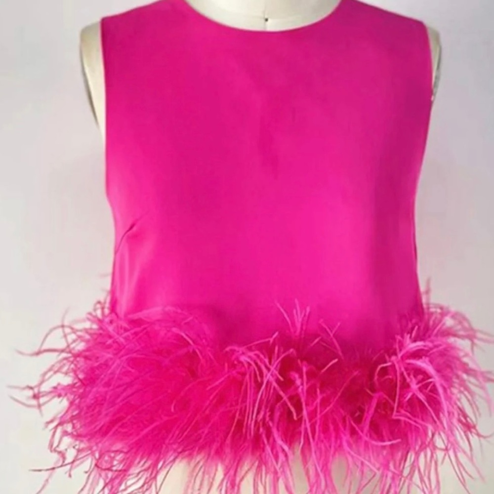Pink trendy and classic top. Great quality.